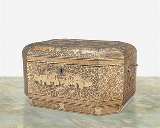 281
A Chinese Export Lacquered Tea Chest
19th Century
The octagonal lacquered wood tea chest with gilt figural scenes and ornamentation, two drop bail handles, lockplate, and fitted with double brass canisters to the interior
7.75" H x 13.5" W x 10.5" D
Estimate: $600 - $900