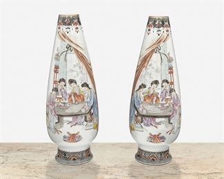 282
A Pair Of Hand-Painted Chinese Porcelain Vases
Late Qing Period (1644-1912)
Each with chop marks and zhuanshu script reign mark
Each hand-painted teardrop-shaped vase depicting a figural scene of four women playing games with an ornamental border and gilt rim raised on a flared foot with geometric designs, 2 pieces
Each: 12.75" H x 4.5" Dia.
Estimate: $700 - $900