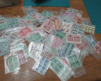 Uncirculated antique US stamps in blocks of 4