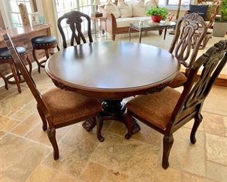 85. Carved Pedestal Dining Table (53" x 30") 
86. Set of 6 Carved Wood Side Chair (23" x 21" x 44")