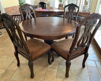 85. Carved Pedestal Dining Table (53" x 30") 
86. Set of 6 Carved Wood Side Chair (23" x 21" x 44")