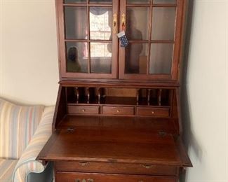 #6	Wood Drop-Front Secretary w/3 drawers & 2 glass doors w/2 shelves  30x17-28x71   (has cubbies inside the drop front)	 $175.00 

