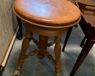 #135	Oak Piano Stool w/Brass Claw Feet  14round x 18"T	 $45.00 
