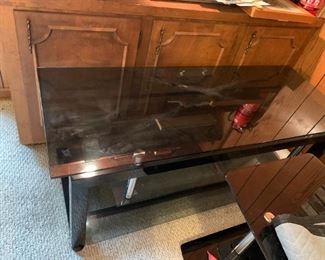 #168	Black Glass TV Stand 52x20x20	 $30.00 
