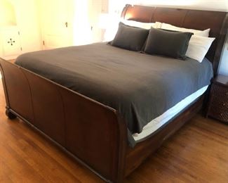 Cal King Sleigh Bed with leather covered head and footboard. Very nice mattress included.