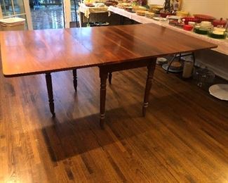 1947 drop leaf dining room table .Made by prisoners at Fort Leavenworth , Kansas .Walnut with wide unusually wide boards. 
