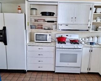Side-by-Side Refrigerator Freezer with Ice & Water; Gas GE Stove; Small Countertop Microwave; Enameled Roaster; Plastic ware (Rubbermaid/Tupperware); White everyday dinnerware; White Cannister Set; Pyrex Dishes and much more.