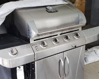 Item #76: $250.  Char-broil brand Commercial grill with cover