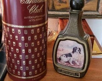 Item #64-65: $22ea. Vintage Canadian Club bottle tin and Jim Beam Decanter