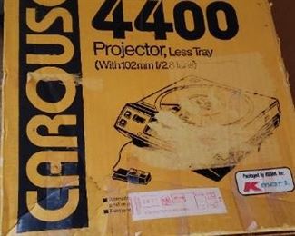 Item #60: $50. Carousel Kodak projector in box. 