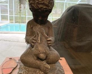Item #85: $35. Child with bunny statuary, concrete like material. 12 H"  