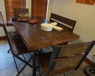 pub style table with 2 benches and 2 chairs