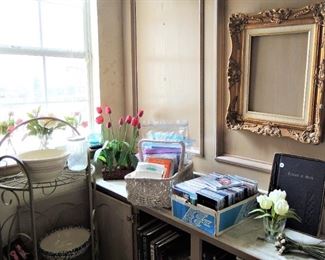 Music CDs, plants, shelf unit, gold frame