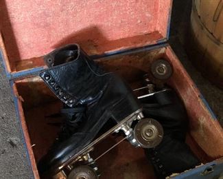 Vintage roller skates in case
