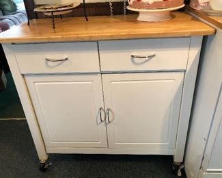 White cabinet with butcher block top!