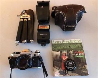 Canon AE -1 program. Made in Germany tripod. 1984 Olympic lens cover.