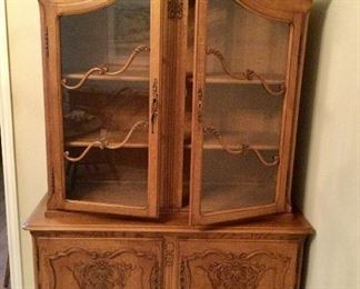 French 1940-50's Carved Oak China Cabinet.  2 Glass Doors, 2 Shelves, 2 Carved Wood Doors-1 Shelf Inside.  (8'h x 49"w x 14"d)[17.5"d @ the bottom section]:  $1,350.00