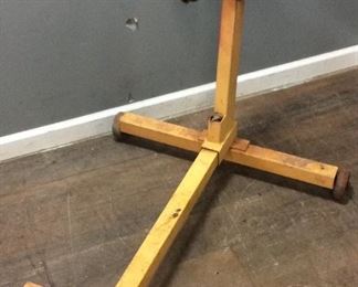 YELLOW ENGINE STAND ON WHEELS