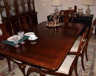 dining table 68" as shown, plus two 15" leaves; six chairs