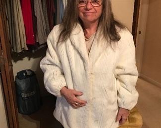 Salma Hayek modeling a white fur jacket