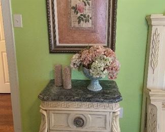 one nightstand with green marble top and metal scroll work