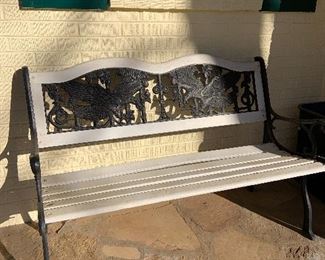wrought iron eagles and wood bench