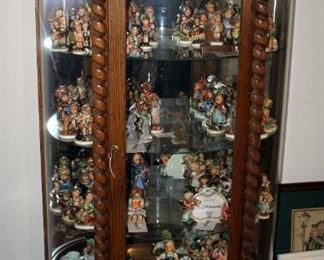Solid Oak Lighted Curved Glass Curio Cabinet With Glass Shelves, Mirrored Back, Carved Claw Feet And Spiral Accents, 65" x 34" x 16"