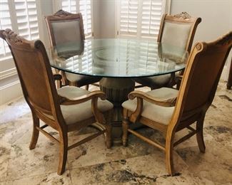Neo-classical style dining table with glass top and four armchairs