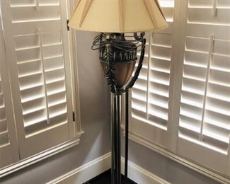 Cast metal floor lamp with antiqued nickel finish