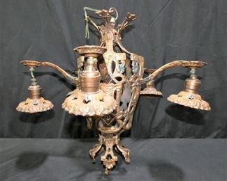Vintage Copper Color Cast Iron 5 Light Chandelier
Description 	
5 Light Cast Iron Chandelier.
Refurbished Copper Color With blue & Yellow Accents.
Rewired.
18" Diameter x 19" Tall
UPS STORE BACKING & SHIPPING
