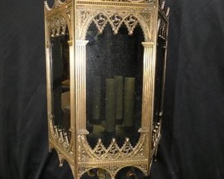  	Art Deco Gothic Metal w/ Brass Finish Chandelier
Description 	
5 Candle Light (one candle cover is missing)
6 Dark Glass Panels slide into place in base
2 Prong Light Plug - Very Long Chain
21" tall x 10" diameter
UPS Store Packing and Shipping