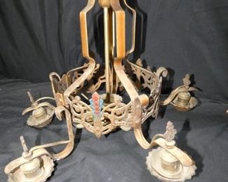  	5 Light Art Deco Chandelier
Description 	
Brass Colored with Blue and Red Accents
"Work in Progress"  - One Panel and 2 Lights need to be connected
16" tall - 20" diameter
UPS STORE PACKING & SHIPPING