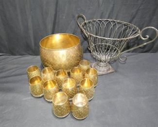  	Brass Punch Bowl and Cups and More
Description 	
- Brass Punch Bowl with 12 Matching Cups
- Cups - 3.75" tall x 3" diameter
- Punch Bowl - 7" tall x 10" diameter
- Urn Shaped Fruit  Basket - 12" tall x 15.5" diameter
UPS STORE PACKING & SHIPPING