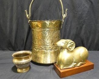  	Brass & Metal Statue, Huge Pot & More
Description 	
- Huge Brass Pot with Handle -Stamped Tropical Motif - with Handle 19.5" tall x 10.5" diameter
- Small Brass Bowl -Enameled in Blue and White-Marked ARTS INDIA  - 4.25" wide x 4" tall
- Brass Seated Ram on Wooden Block - Block - 8.5" x 3.75"  - 7.5" overall height
- Metal Satue of  Don Ceasar broken at arm & sword 20.5" tall
UPS STORE PACKING & SHIPPING