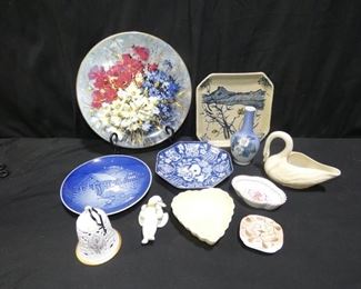 11 Pieces Porcelain B&G, Wedgwood, Balleek
Description 	
- Bing and Grundal -Christmas 1975 - 7" Diameter
- Small Cherub  - 4" Tall
- Wedgwood Bell-year 2000 - 4" Tall
- Blue Plate with Flowers - Royal Dalton " Country Bouquet"-10.5" Diameter
- Asian Ceramic  - 7.5" x 7.5 " Signed
-Blue and White Asian Octagon Shaped Dish - 6.5" x 6.5"
-Balleek Swan Trinket Dish - 6" x 3" Tall
-Balleek - Heart Trinket Dish - 4.5" x x1.5" Tall
-Royal Copenhagen Prim Rose Bud Vase - 6" Tall
-2 - Small Unmarked Trinket Dishes
UPS STORE PACKING & SHIPPING AVAILABLE