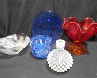  	Colored Glass Hobnail & More
Description 	
-Hobnail  Bud Vase - 5" Tall
-Blue Plate - 8"
-Hand Blown Pot Signed - 4" Diameter x  3"Tall
-Beautiful Opalescent Pink Frosted and Clear Glass7.5" Diameter3" Tall 
-Red To Amber Fluted Candy Dish  - 7" Diameter x 7" Tall
UPS Pack and Ship