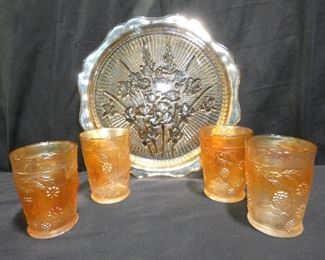 Carnival Glass and Depression Glass
Description 	
-Yellow  Depression Glass Plate  -11" Diameter 
-Clear Etched Flowers on Depression Glass 8" Plates
-4- Amber 8oz Water Glasses with Grapes
-Orange opalescent  Carnival Glass Platter - 12" Diameter
