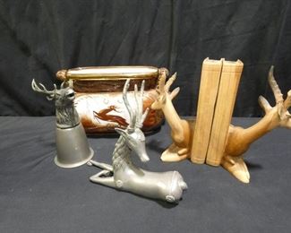 Stag Decor and more
Description 	
- Wooden Bookends - 7.5" Tall Broken Antler
- Silver Tone Sitting Stag 8" Wide and 7.5" Tall
- Pewter Stag Cup  3" Diameter and 6.5" Tall -marked Italy
- Porcelain Planter with Gold accents - marked 11.5" x x55 x 6.5" Tall
SHIPPING AVAILABLE