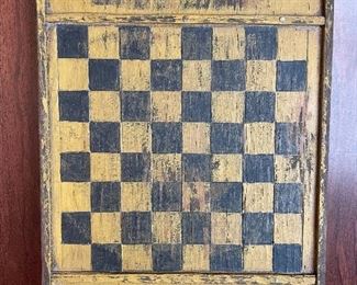 Item 10: Distressed, primitive-style checker board with detailing on the ends by folk artist Charles Jerred - 6.5" x 9.5": $55