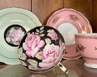 Item 140:  Two teacups, one with rose pattern:  $24