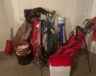Large Grouping of Golf Clubs and Balls
