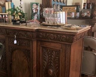 Bottom and top of a bar with fabulous carving (Has brass foot rail.)