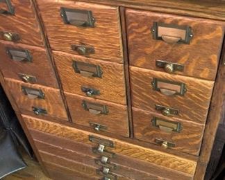 One of two antique oak card catalogs