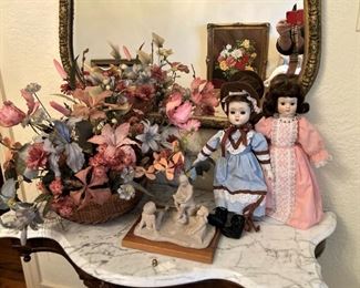Marble top antique table; dolls; mirror