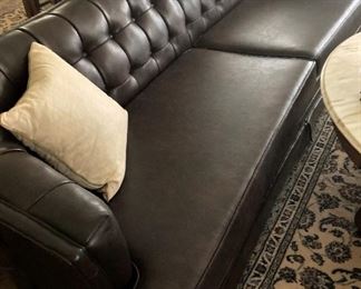Extra long tufted-back sofa