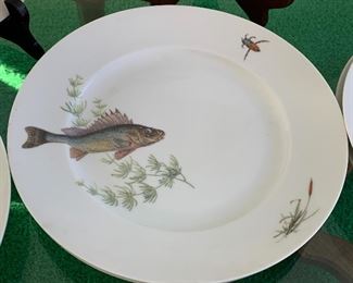 KPM Krister (Germany) Platter and Plates. Beautiful fish motif. This fun lot includes a platter, gravy dish and 12 plates in four different patterns. No noticed chips or cracks. The platter measures 24" x 9"