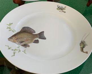 KPM Krister (Germany) Platter and Plates. Beautiful fish motif. This fun lot includes a platter, gravy dish and 12 plates in four different patterns. No noticed chips or cracks. The platter measures 24" x 9"