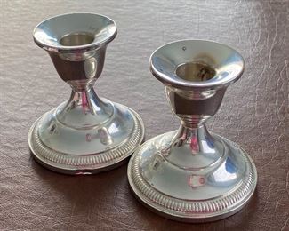 Sterling Candle Holders - lovely weighed sterling candle holders by Fisher- (marked Fisher 830 on the bottom) Measures 3.5" H. One has a slight dent on the bottom/side.