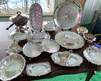 17 Pieces of Vintage Silver Plate Serving Items. Includes a divided dish, covered dishes, chaffing dish, trays and more 