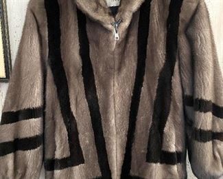 Ladies Fur Coat w/ Unique Design - Quality crafted coat from Ribnick Furs. Comes with a pair of earmuffs.  This jacket has two front pockets and a quality interior lining that is stitched inside with the previous owner's name. No size label, however; likely a size small.  